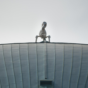 A lonely dinosaur skeleton sits atop Kresge Oval Oct. 23, likely placed there by hackers
